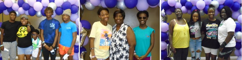 A group of family members posing with each other in front of balloons at the event.