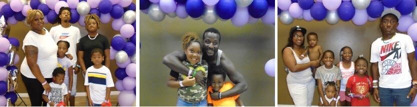 A group of three families posing in front of balloons at an event. 