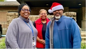 Councilman Lester Cromer and THA staff stand together smiling.