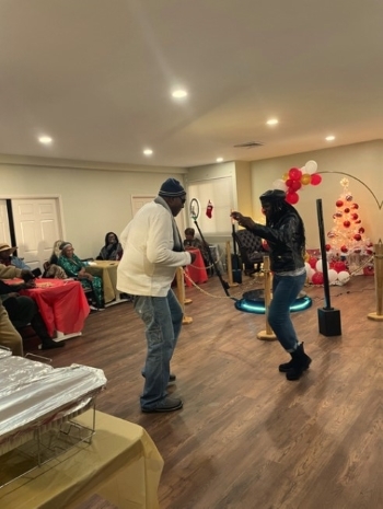 Residents listening to music, dancing, and having fun.