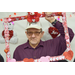 A man holding a frame in the photo booth