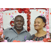 Smiling man and woman in a photo booth