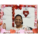 A woman in a valentines day photo booth