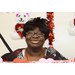 A close up of a smiling woman in a photo booth