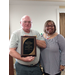 Ms. Clark presenting a 20 years service recognition plaque to David Blosch