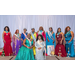 The Ms. Full Figured Pageant Queens at stand and sit together smiling.