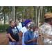 Residents are lined up to get a cup of ice-cream. 