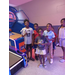 Kids standing in front of a game at an arcade.