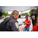  A Tifton Police Officer handing out information to a couple of kids. 