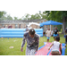  Two boys playing with soap and a sprinkler. 